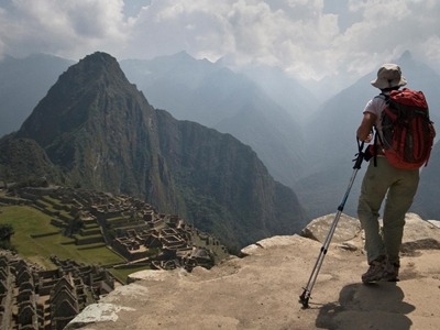 A hiker finishing the Inca Trail in South America on a Southern Crossings vacation.